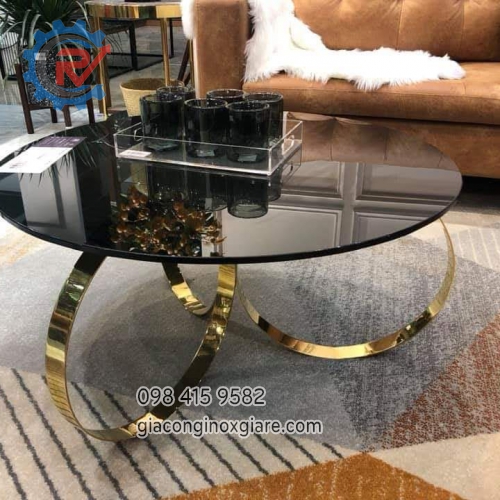 Bàn trà phòng khách chân kiểu bằng inox mạ PVD vàng bóng gương.